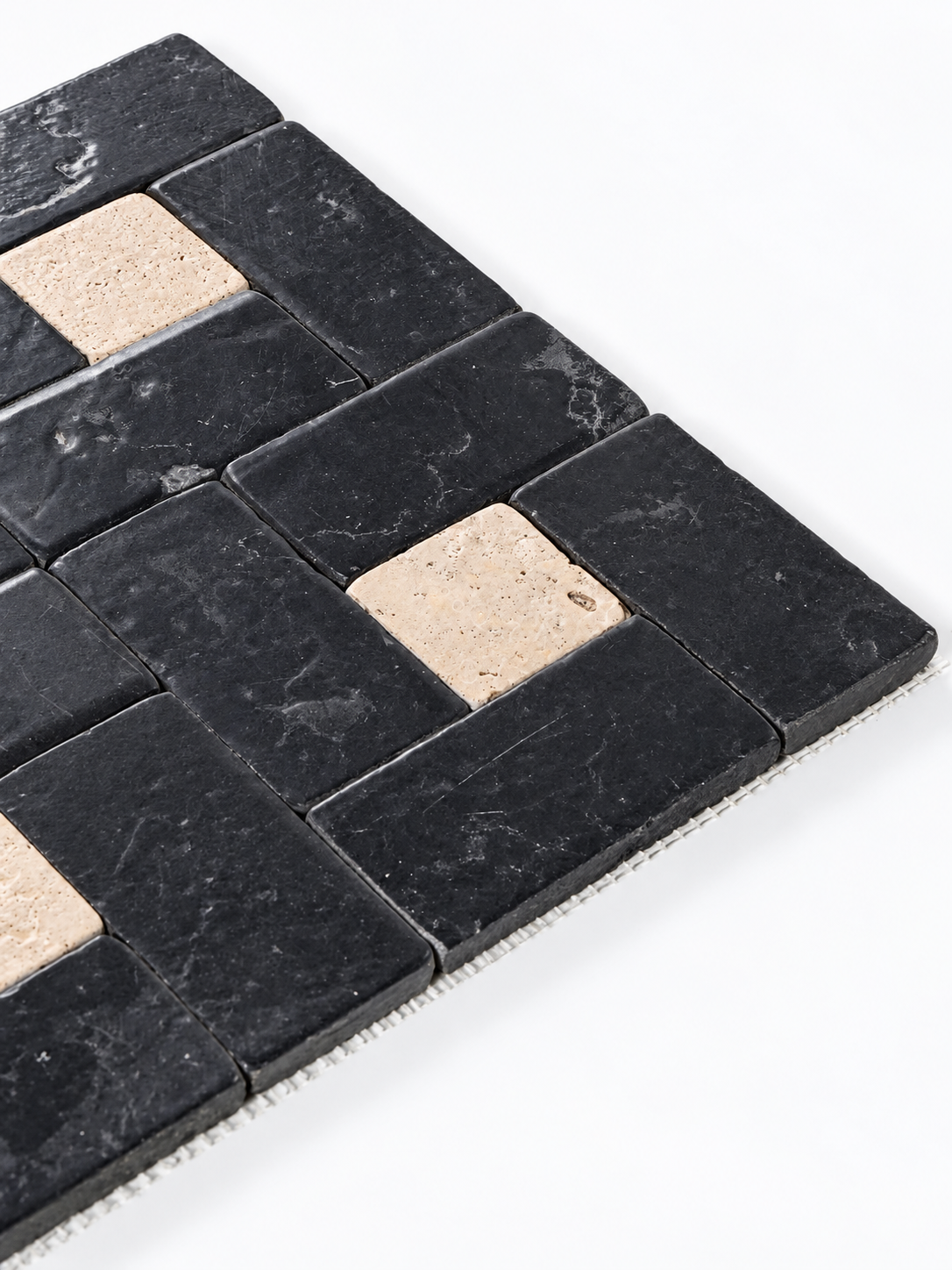 Black rectangular stone mosaic tiles with light beige inlay squares, shown on a clean white background.