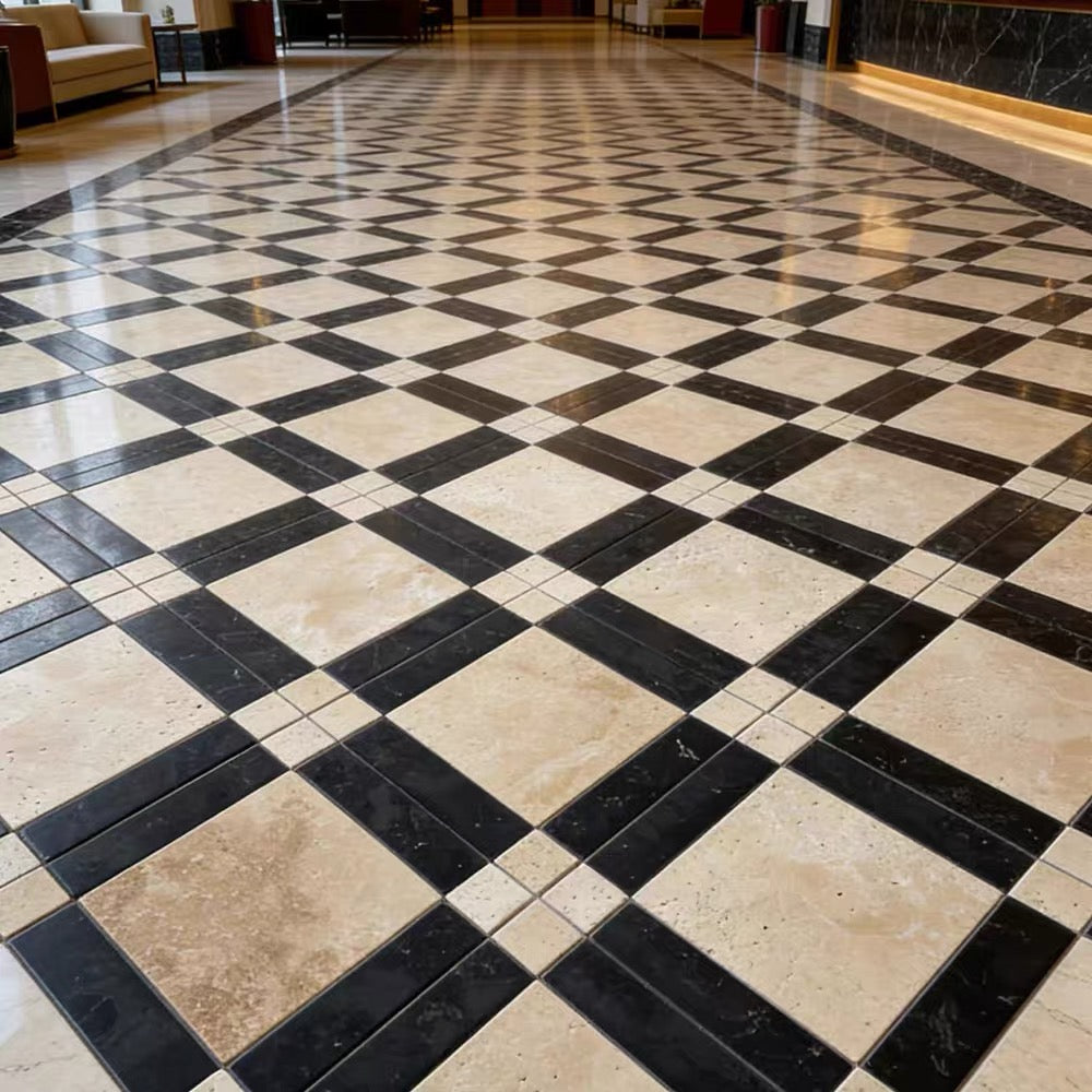 A polished black and beige checkered tile floor in a grand lobby or hall, with cream stone tiles alternating with dark charcoal-black marble-look tiles in a diamond pattern.