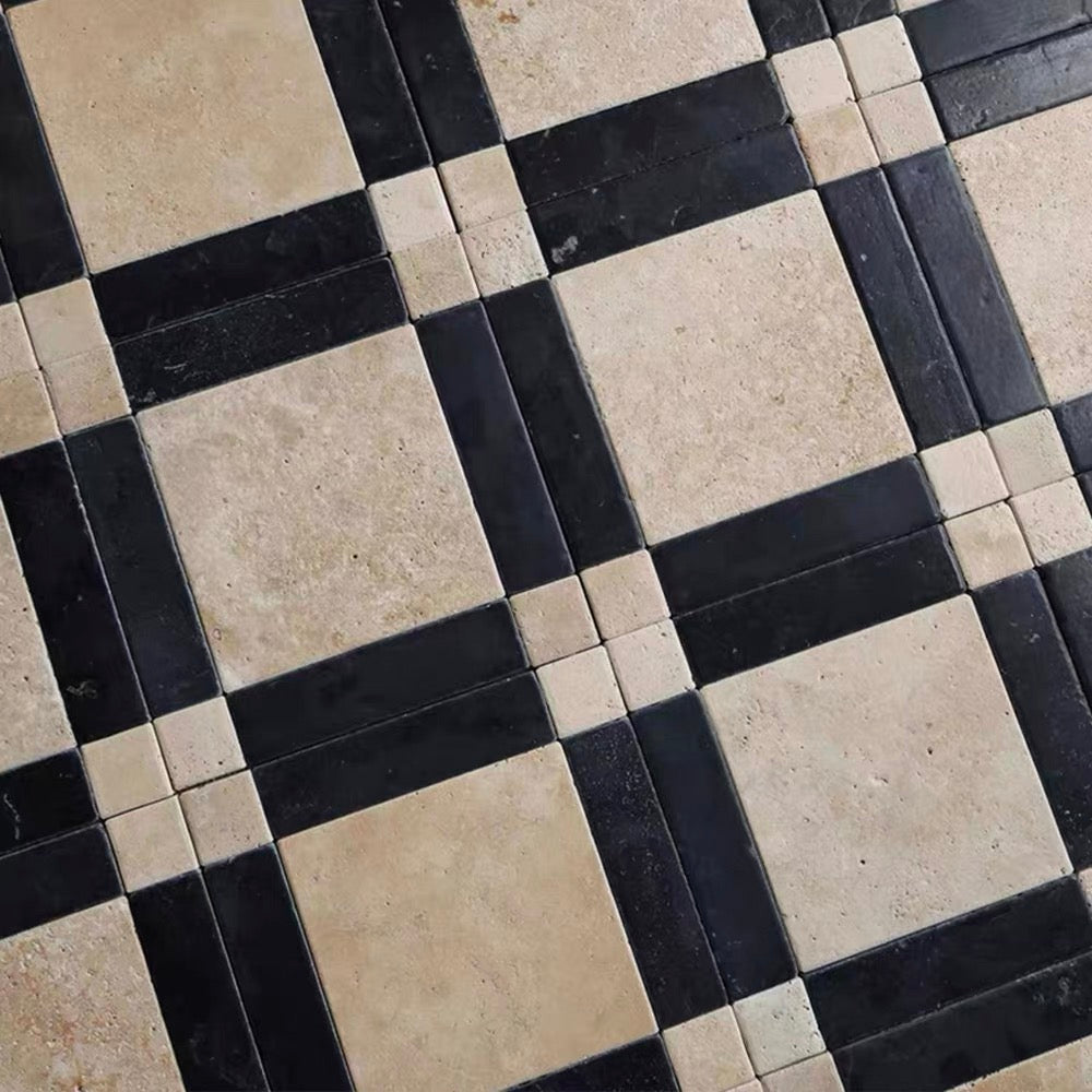 A close-up of a checkered tile pattern featuring large beige square tiles alternating with black rectangular tiles, plus small beige accent tiles at the intersections.