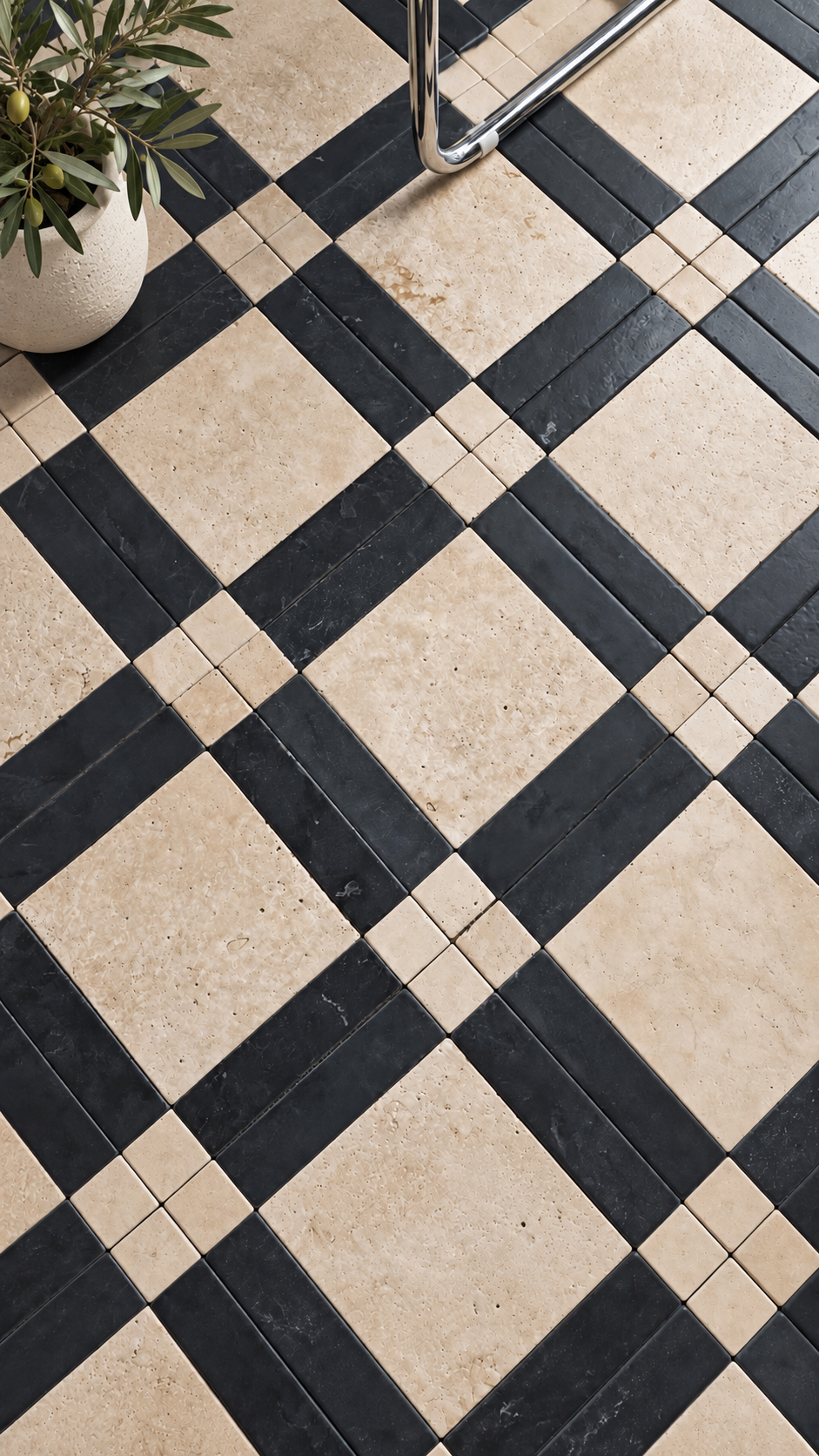 Black and beige checkered stone floor tiles with a small potted plant in the top-left corner and part of a metal chair leg visible at the top.